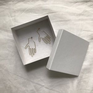 Gold plated hand earrings similar to Young Frankk